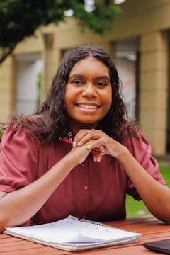 Portrait Of Female Aboriginal Australian Student On University Campus